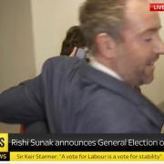 The Sky News correspondent can be seen being removed here