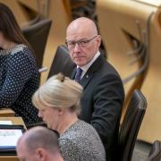 John Swinney pictured at FMQs today