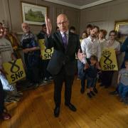 Scottish National Party leader John Swinney during a visit to The Dower House Cafe in Edinburgh