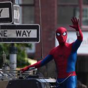 A person in a Spider-Man suit during filming on Hutcheson Street in Glasgow for the latest film in