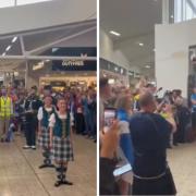 Fans belted out Flower of Scotland while waiting to board flights to the US at Edinburgh Airport