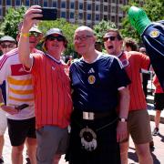 Scottish First Minister John Swinney with Scotland fans at the FIFA Fan Festival ahead of the FIFA World Cup