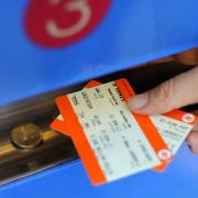 John Swinney has set aside £15 million for a six month pilot scheme that will abolish peak fares on Scotland's railways