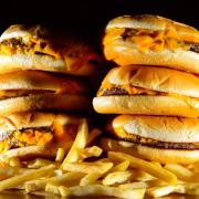 A stack of 'junk food' burgers and fries. Dominic Lipinski/PA Wire
