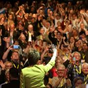Nicola Sturgeon waves to SNP members at the party's 2019 conference