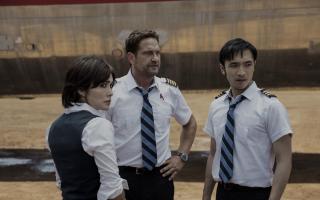 Gerard Butler as Brodie Torrance and Yoson An as Samuel Dele in Plane