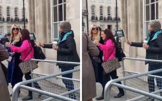 Paris Hilton walks away as she's offered an NUJ flag at the BBC picket line in London today
