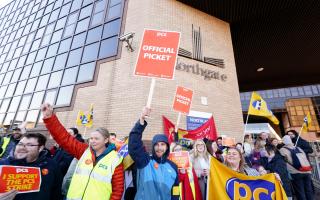 Members of the PCS union on the picket line outside the Passport Office in Glasgow.