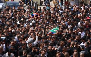 People gather for the funerals of Samer El Shafei and Hamza Kharyoush in the occupied West Bank