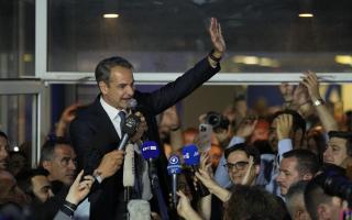 Prime Minister and leader of New Democracy Kyriakos Mitsotakis addresses supporters at the headquarters of his party in Athens