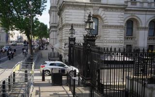 The scene after a car collided with the gates of Downing Street in London