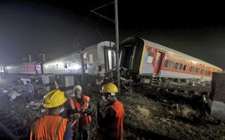 Ten to 12 coaches of one train derailed, and debris from some of the mangled coaches fell onto a nearby track.