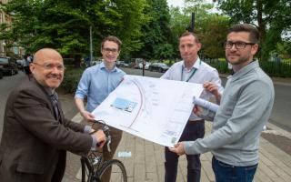 Minister for Active Travel Patrick Harvie, Cllr Angus Millar and the Glasgow City Council project team look at the design map for the Connecting Battlefield Active Travel Project