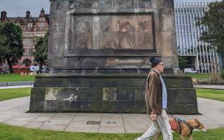 A slavery plaque which has sparked debate was removed from a statue in St Andrew's Square