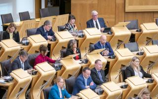 The SNP's Fergus Ewing (top right) during First Minister's Questions at the Scottish Parliament in Holyrood