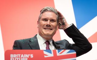 Keir Starmer speaking at Labour's conference, where Union flags were on show in all corners