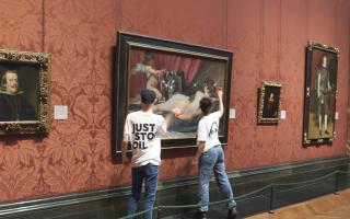 Two activists have been arrested for smashing glass protecting a painting at the National Gallery in London
