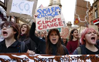GLASGOW, SCOTLAND - OCTOBER 28: Climate protesters march through the city centre  on October 28, 2022 in Glasgow, Scotland. The march was timed to mark the anniversary of the COP26 climate summit, held in Glasgow last year. The protesters called the COP