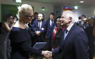 Yulia Navalnaya, widow of Russian opposition leader Alexei Navalny, left, shakes hands with European Union foreign policy chief Josep Borrell
