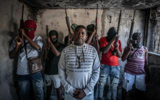 Gang Leader Jimmy 'Barbecue' Cherizier with G-9 federation gang members in the Delmas 3 area on February 22, 2024 in Port-au-Prince, Haiti