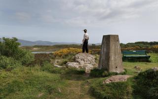 The Glaid Stone viewpoint and the trig point on Great Cumbrae looking towards Minnemoer, the site of a proposed solar farm.  Photograph: Colin Mearns