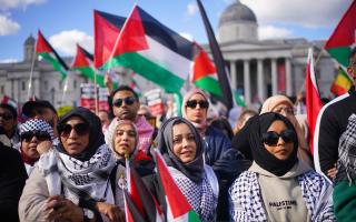 People taking part in Stop the Genocide in Gaza national demonstration in Trafalgar Square