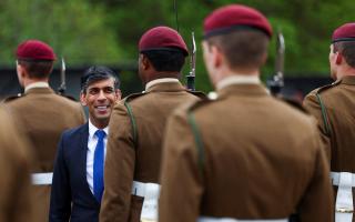 Prime Minister Rishi Sunak smiles as he inspects the Passing Out Parade of the Parachute Regiment recruits during his visit to the Helles Barracks at the Catterick Garrison in early May