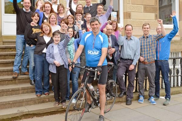 Alistair Dutton is cheered on his way as he begins his cycle trek