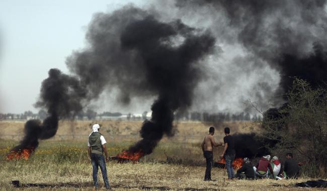 Palestinian protestors attended a protest next to the Gaza Strip border with Israel on Friday. Photograph: AP