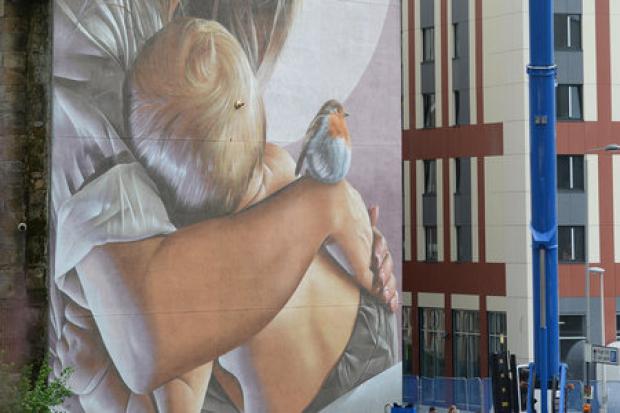 Smug's mural of Thaney and her son Mungo, at the corner of Glasgow's High Street, conveys a message about finding refuge in the city