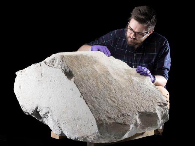 National Museums Scotland assistant curator, Dr Daniel Potter, with the casing stone from the Great Pyramid of Giza