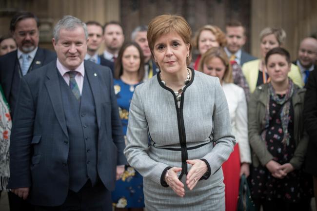 NIcola Sturgeon, pictured with the SNP MPs, said she will set out what Brexit means for Scotland in the longer term