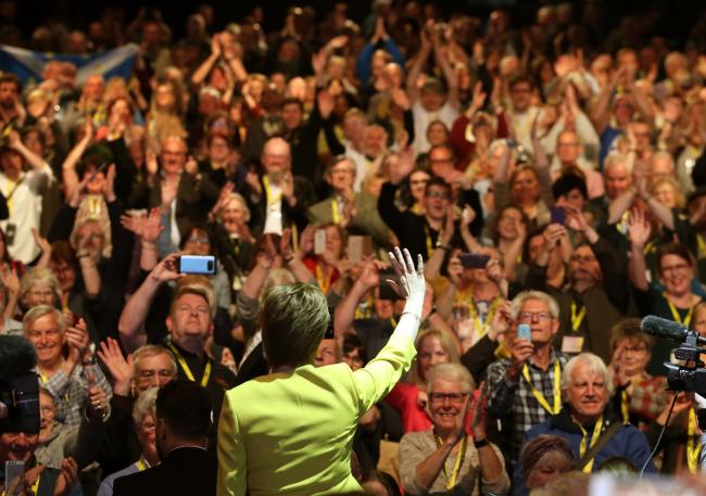 Nicola Sturgeon waves to delegates after her speech during the SNP spring conference in 2019
