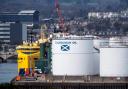 FILE - Supply vessels used in the oil, gas and renewable energy industry are docked by the Caledonian Oil's tank, at the Aberdeen Harbour, in the North East of Scotland, on April 29, 2022. (Photo by Andy Buchanan / AFP) (Photo by ANDY BUCHANAN/AFP