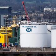 FILE - Supply vessels used in the oil, gas and renewable energy industry are docked by the Caledonian Oil's tank, at the Aberdeen Harbour, in the North East of Scotland, on April 29, 2022. (Photo by Andy Buchanan / AFP) (Photo by ANDY BUCHANAN/AFP